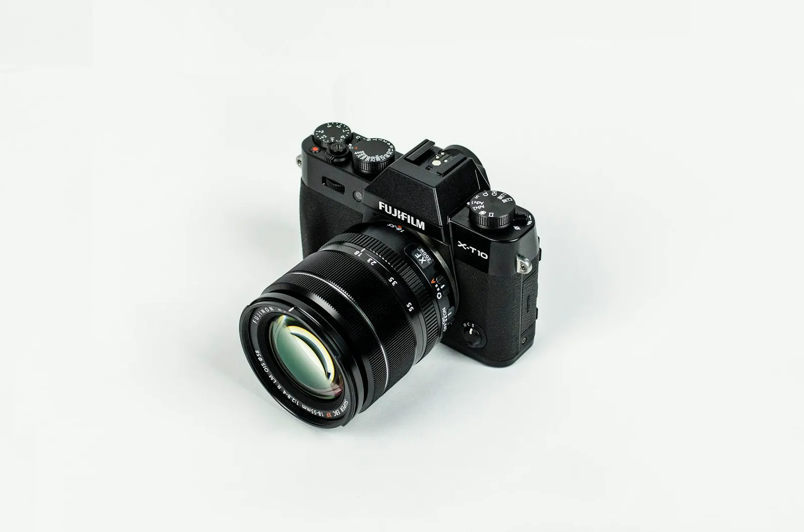 Camera and lens on a white background