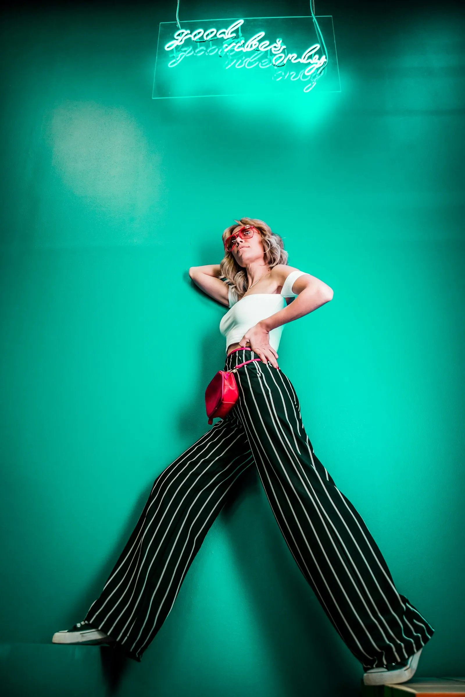 Fashion model against a green background