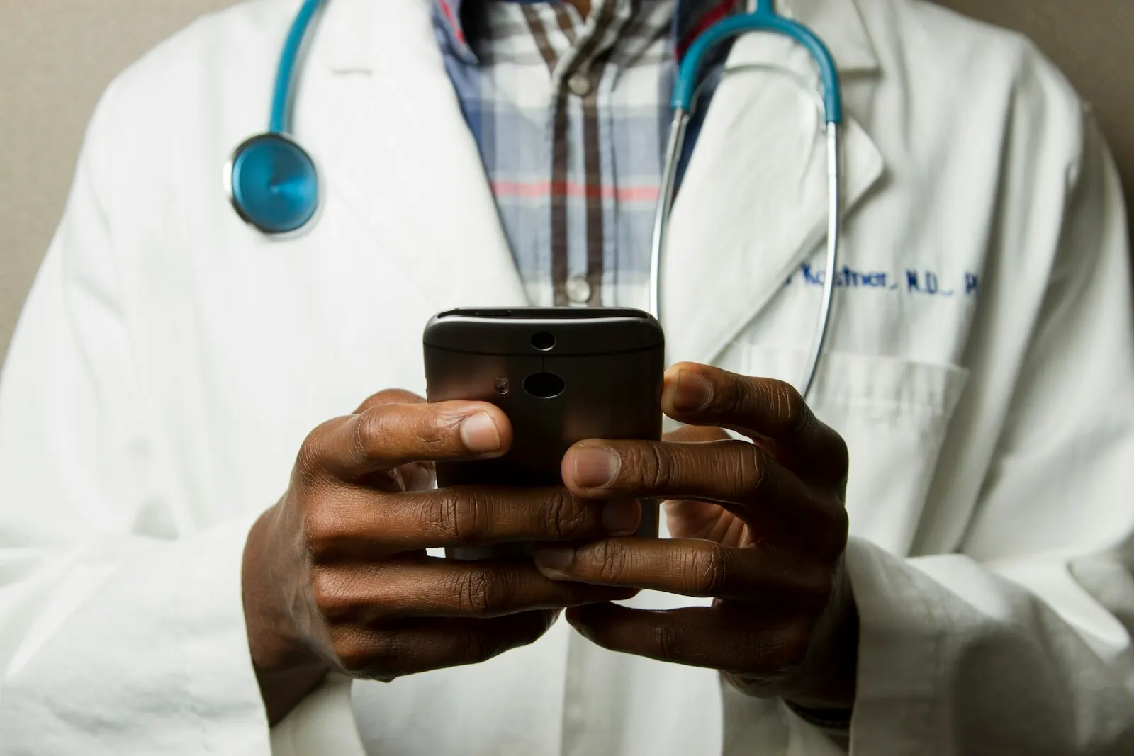 Doctor holding a smartphone and stethoscope